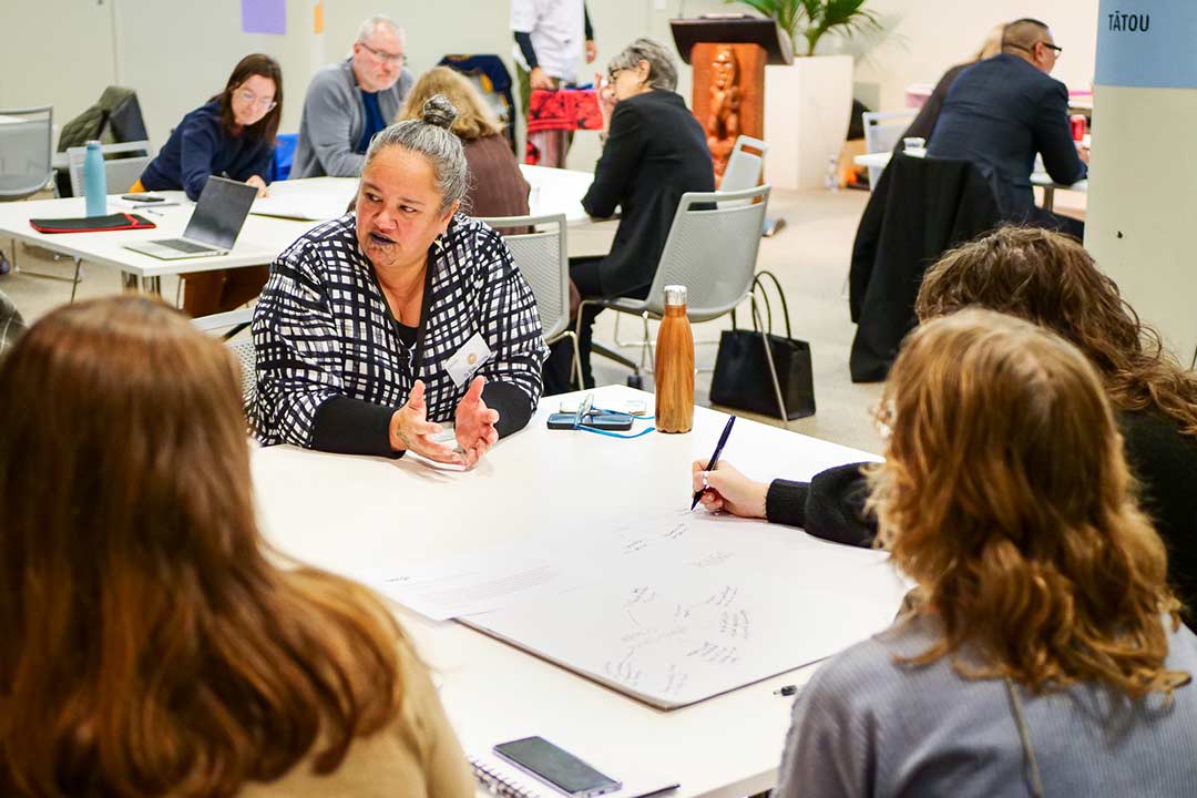 Staff sitting at desks during a workshop