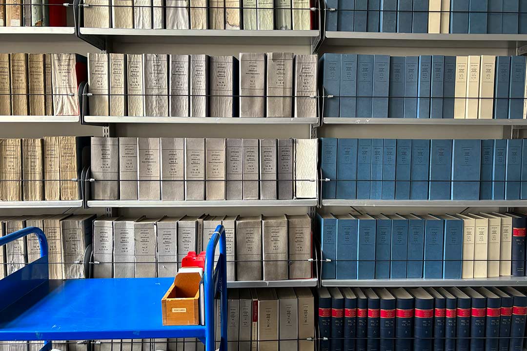 Legislation books on library shelves