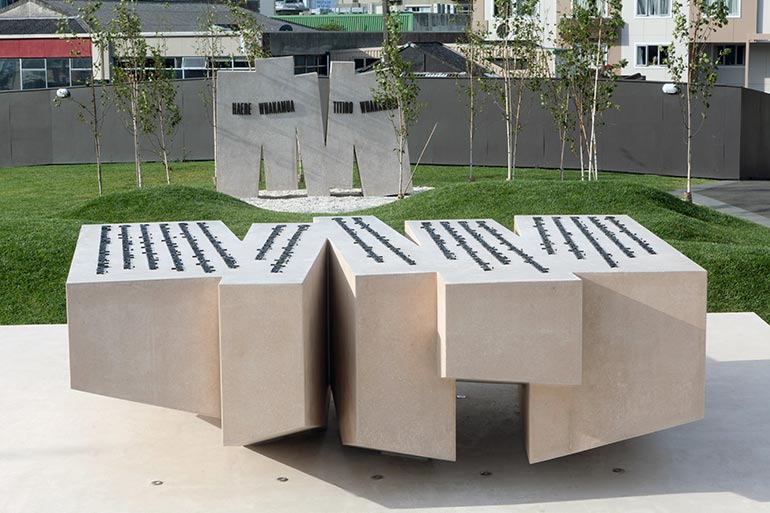The French Memorial at Pukeahu, there are two white stone sculptures with text on them.