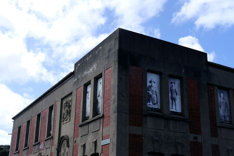 General Headquarters building, a red brick building with pictures of soldiers in the windows.