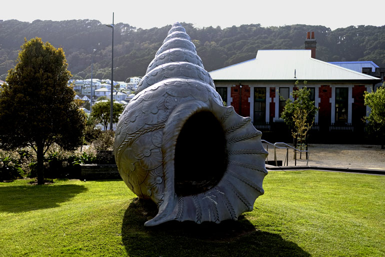 A large bronze conch shell.