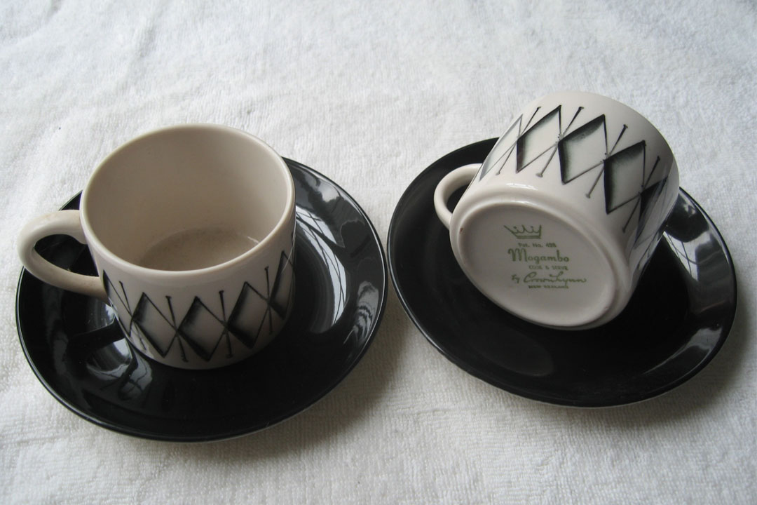 Two Crown Lynn cups on saucers