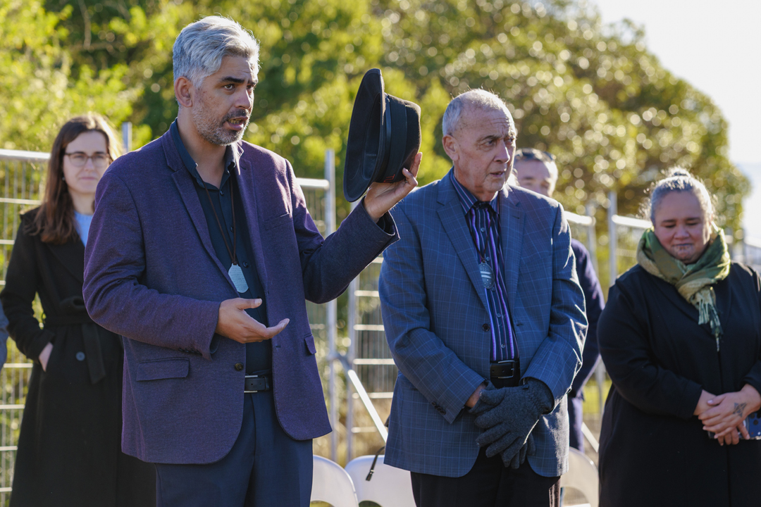 Listening to man speaking at blessing ceremony