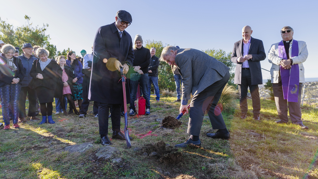Lifting sod at blessing ceremony