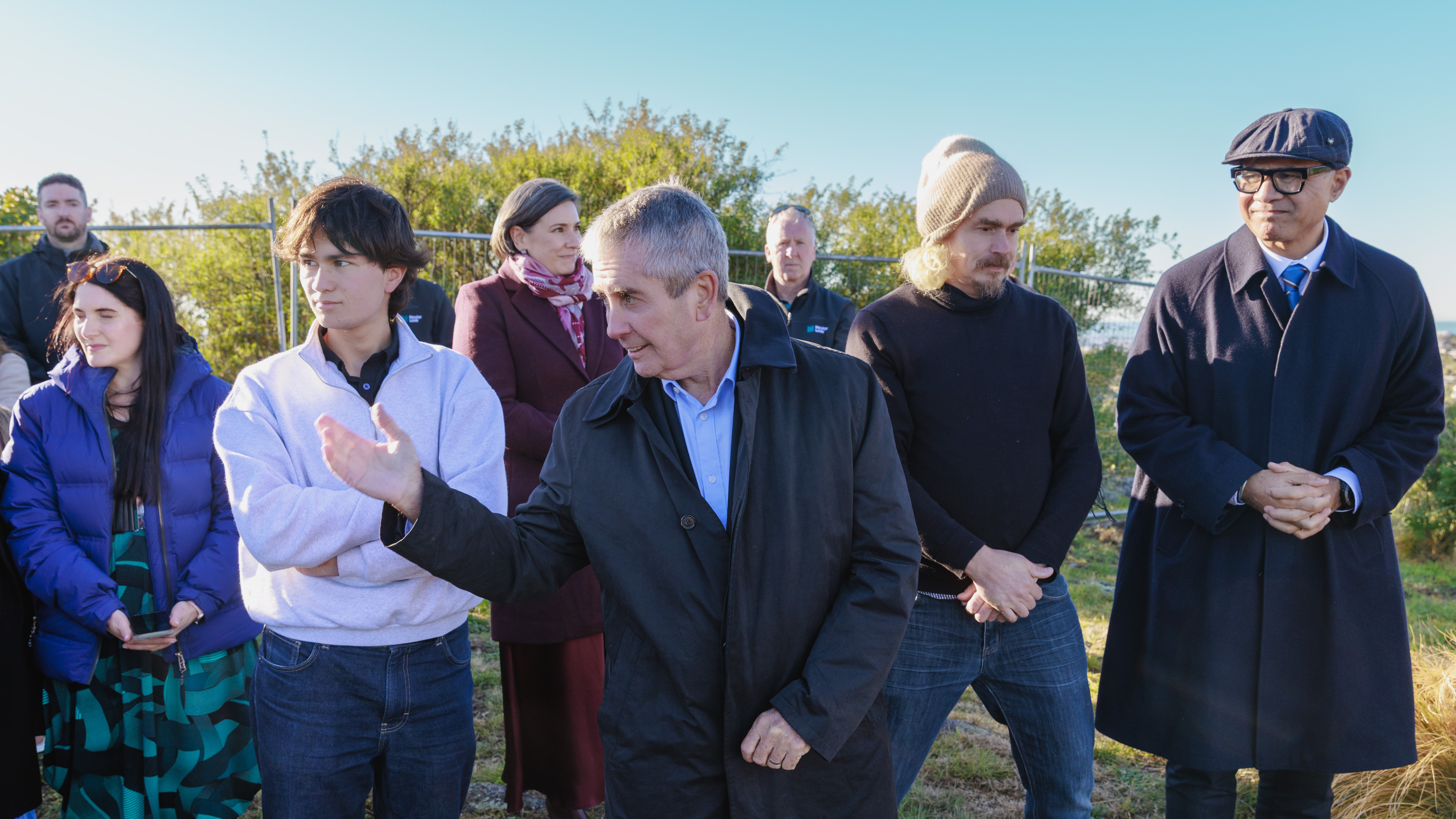 Group with hands crossed at blessing ceremony