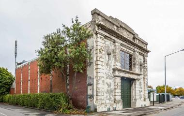 Dilapidated old two-storey building on corner section