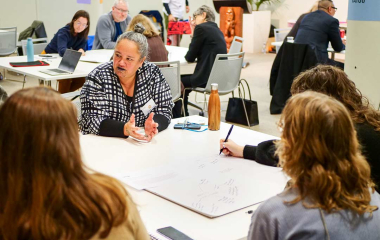 Staff sitting at desks during a workshop