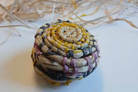 a small woven rattan balll.