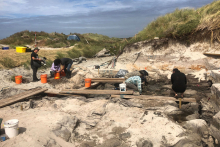 People working on a excavation site at the Chathham Island
