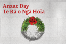 Image a green floral wreath with red poppies at the top and white leaves at the bottom.